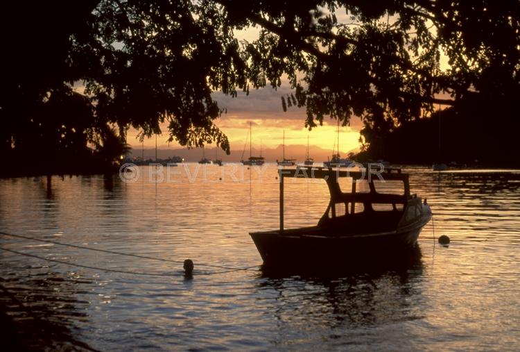 Sunset Island;colorful;yellow;sunset;sky;water;boat;pink;sillouettes;boat;Fiji